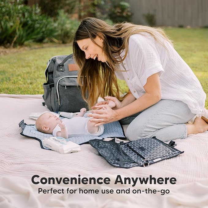 KeaBabies Portable Diaper Changing Pad - Large Waterproof Baby Changing Mat, Compact Travel Diaper Clutch, Functional Pockets Fit Newborn Essentials, Wipeable & Padded Baby Changer (Dino Ridge)